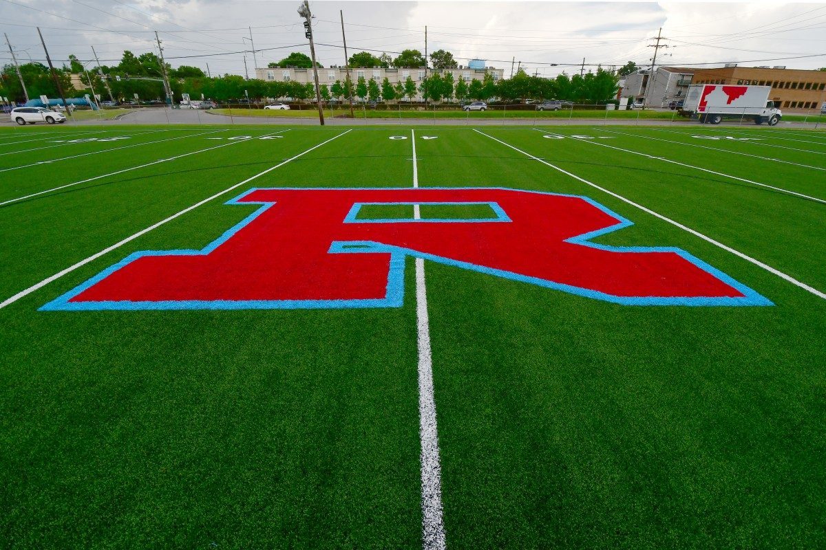 The turf field with the red and Columbia blue R at midfield