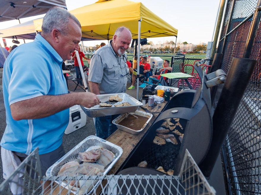 Backyard chefs working the grill