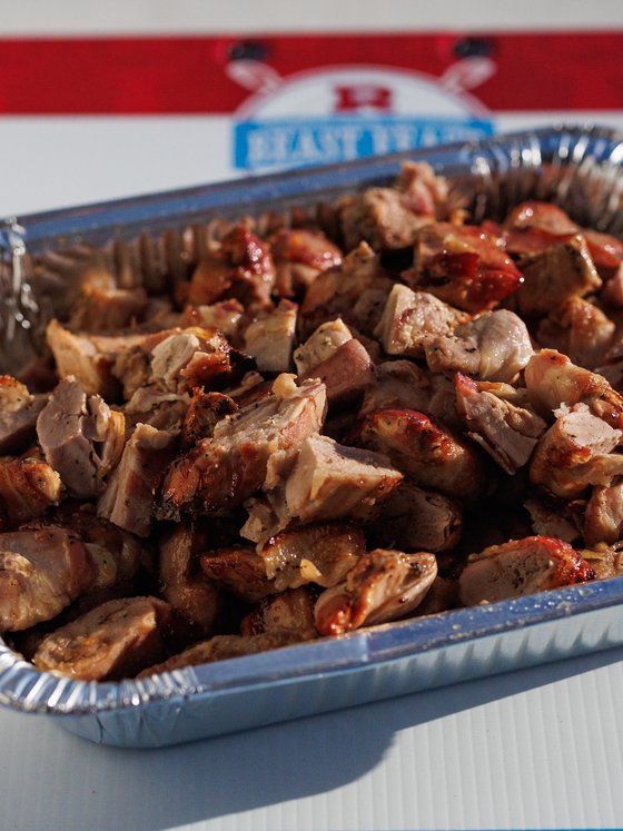A tray of smoked meat on the Beast Feast board