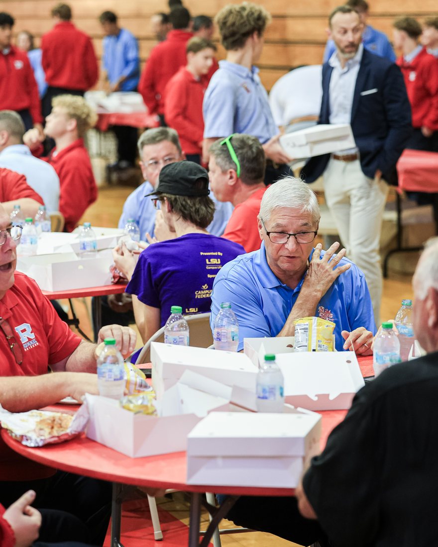 The gym floor full of round tables during the lunch