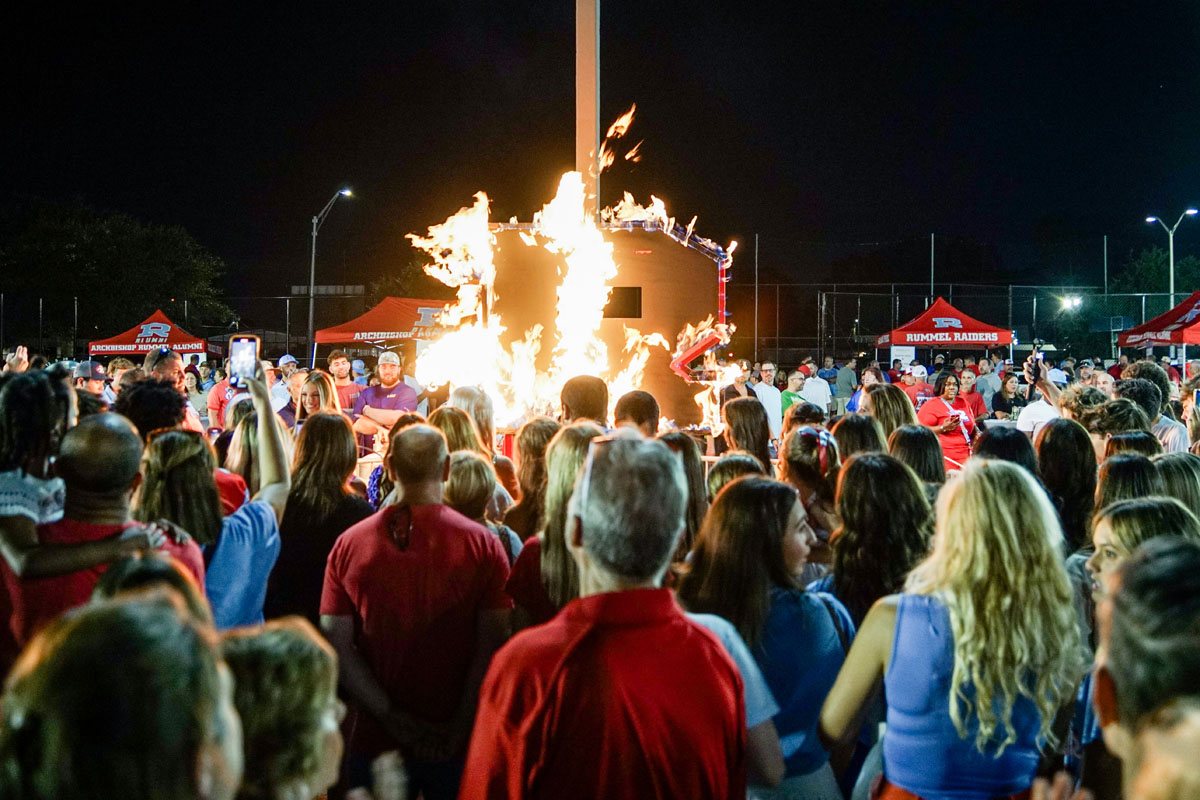 The burning R with alumni and families watching
