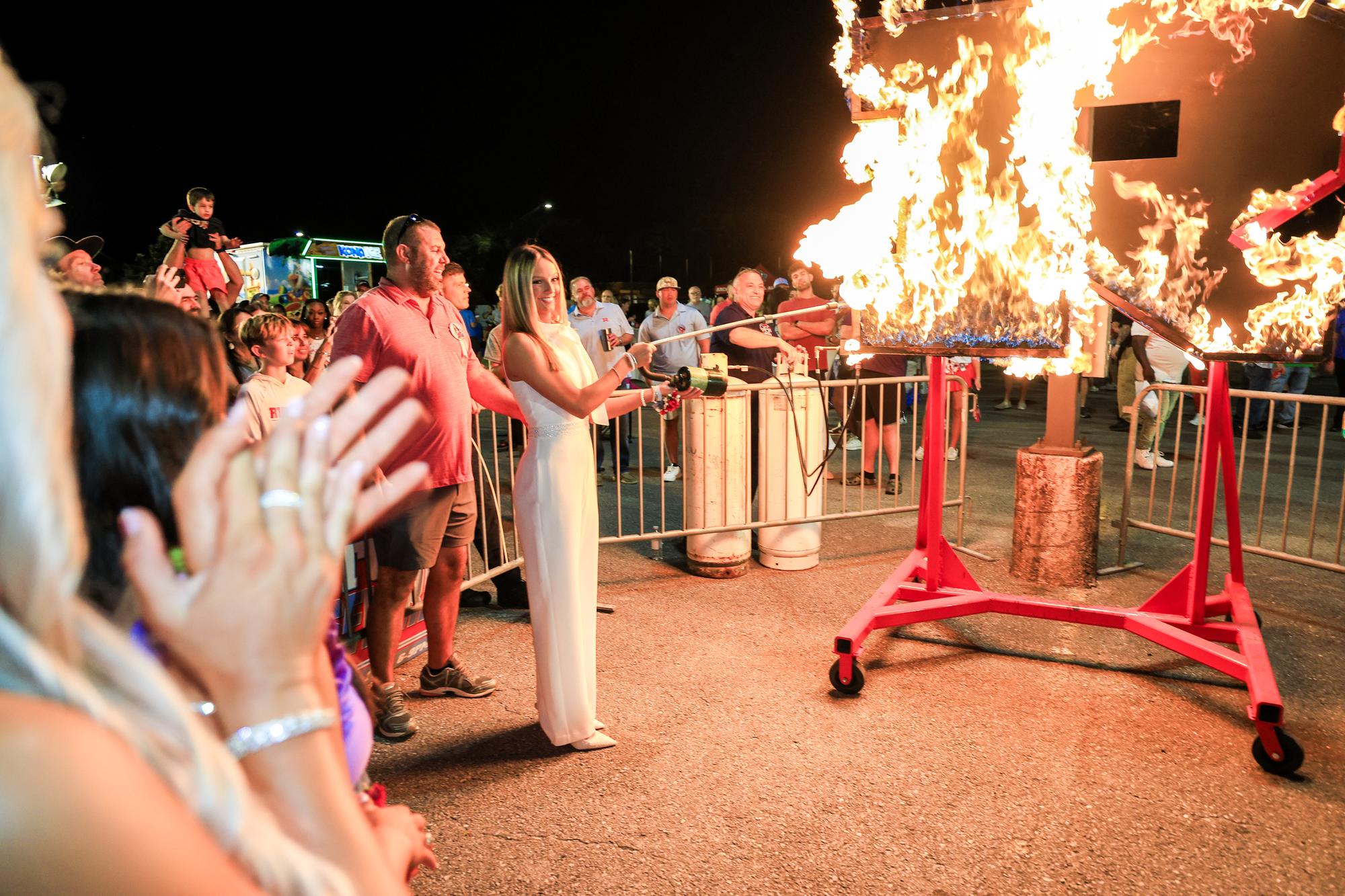 The burning R with alumni and families watching