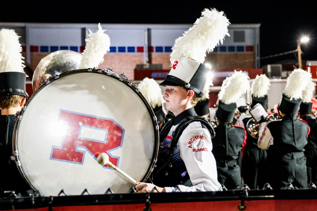 A Raider drummer on the R bass drum with the band in step behind