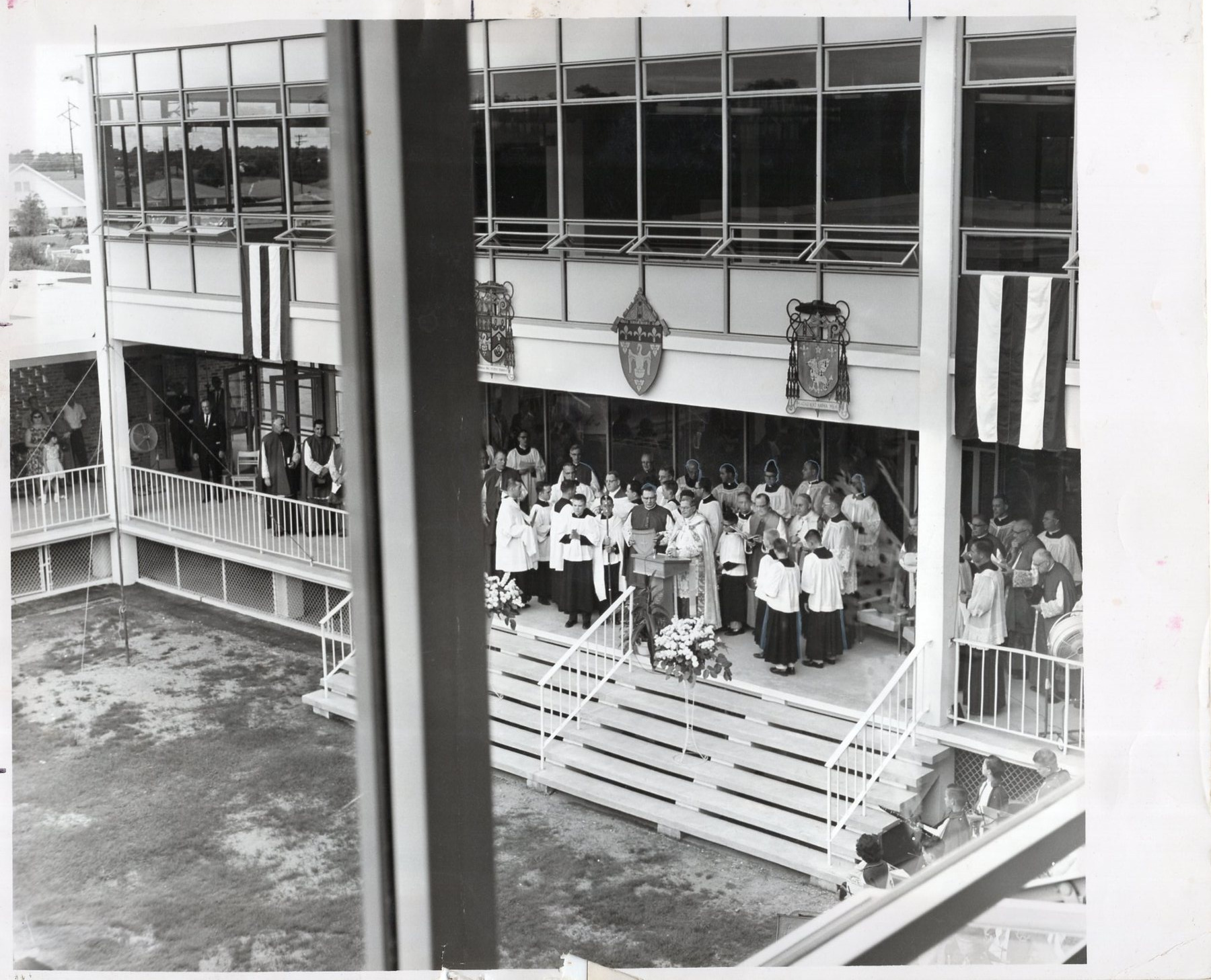 Clergy and a crowd at the blessing of the new campus, 1962