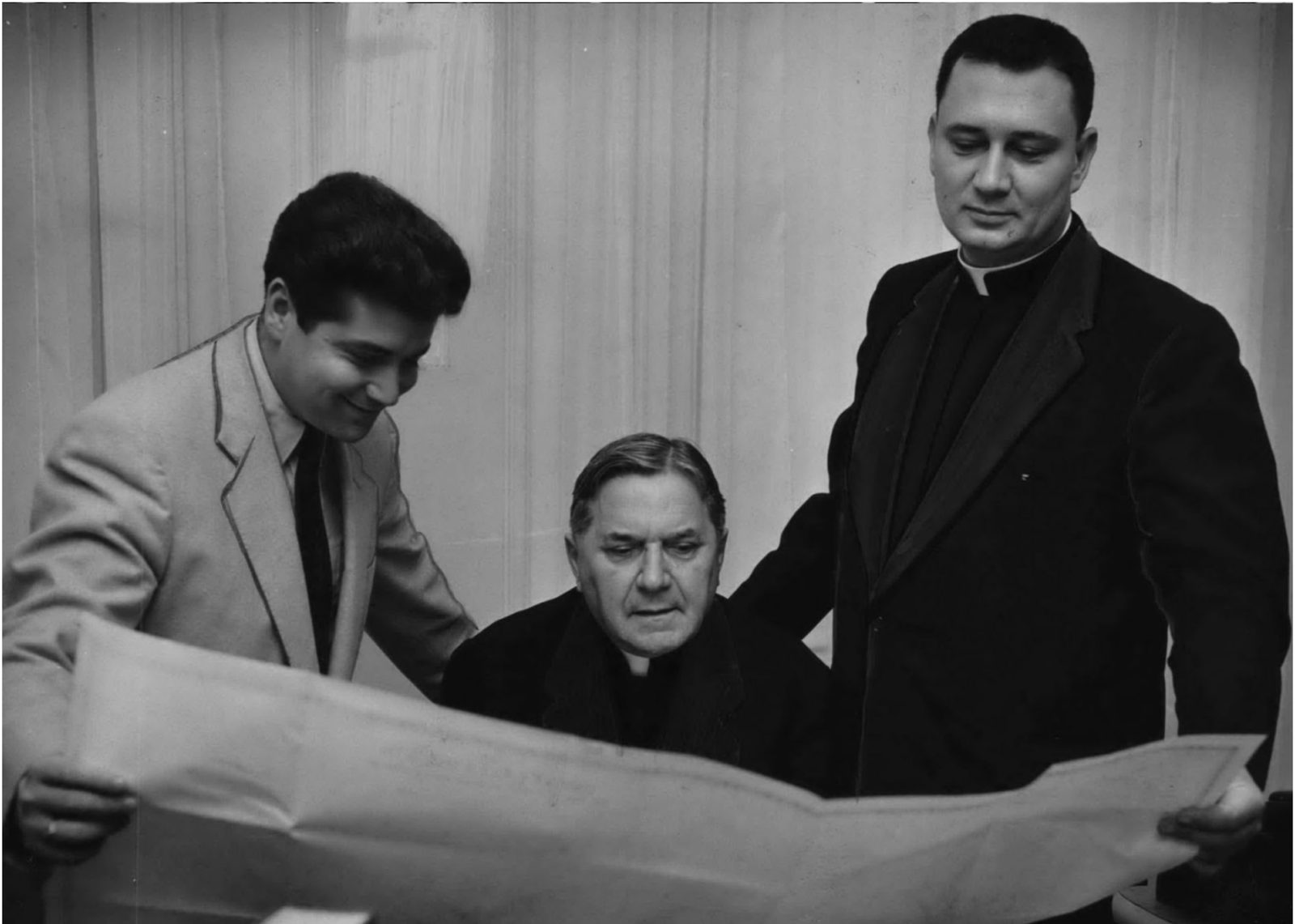 Archbishop Rummel reviewing pilgrimage plans in 1954