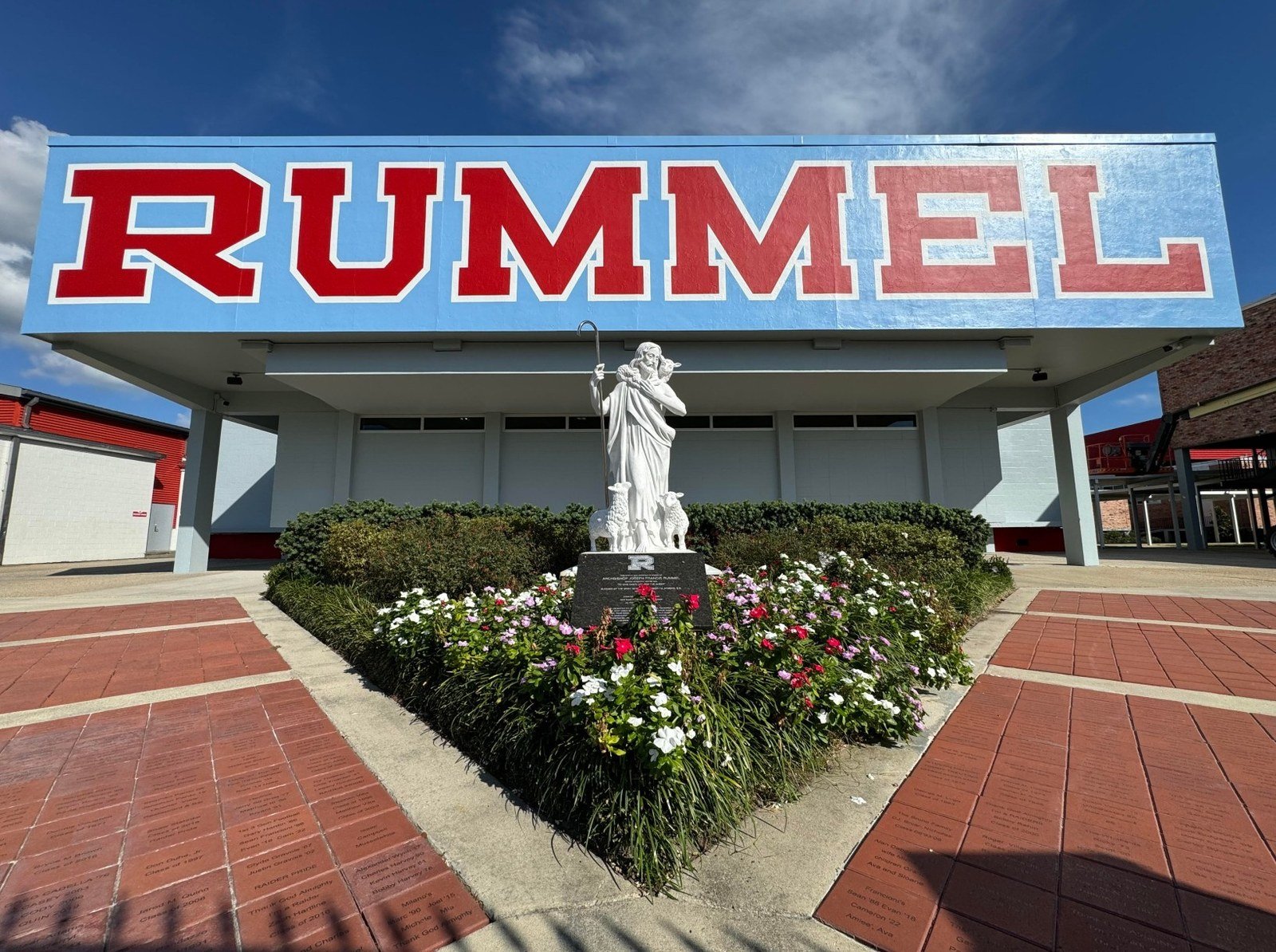 The Christ the King statue at the center of the Rummel campus
