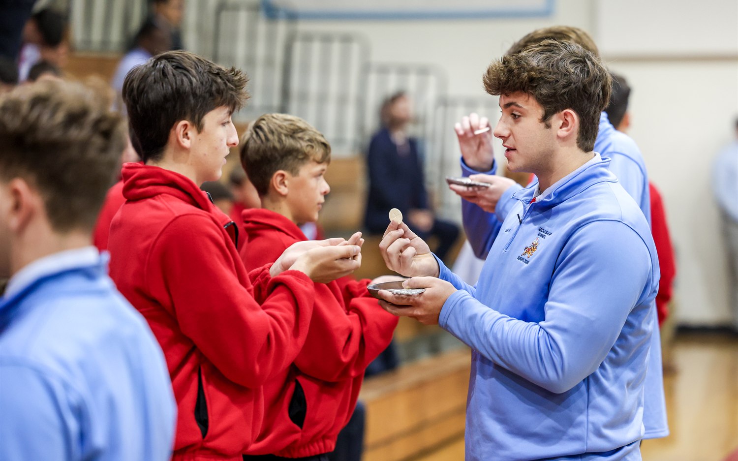 A Rummel student minister serving his peers