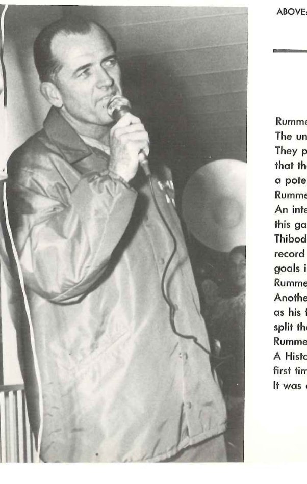 Coach Don Perret with a microphone