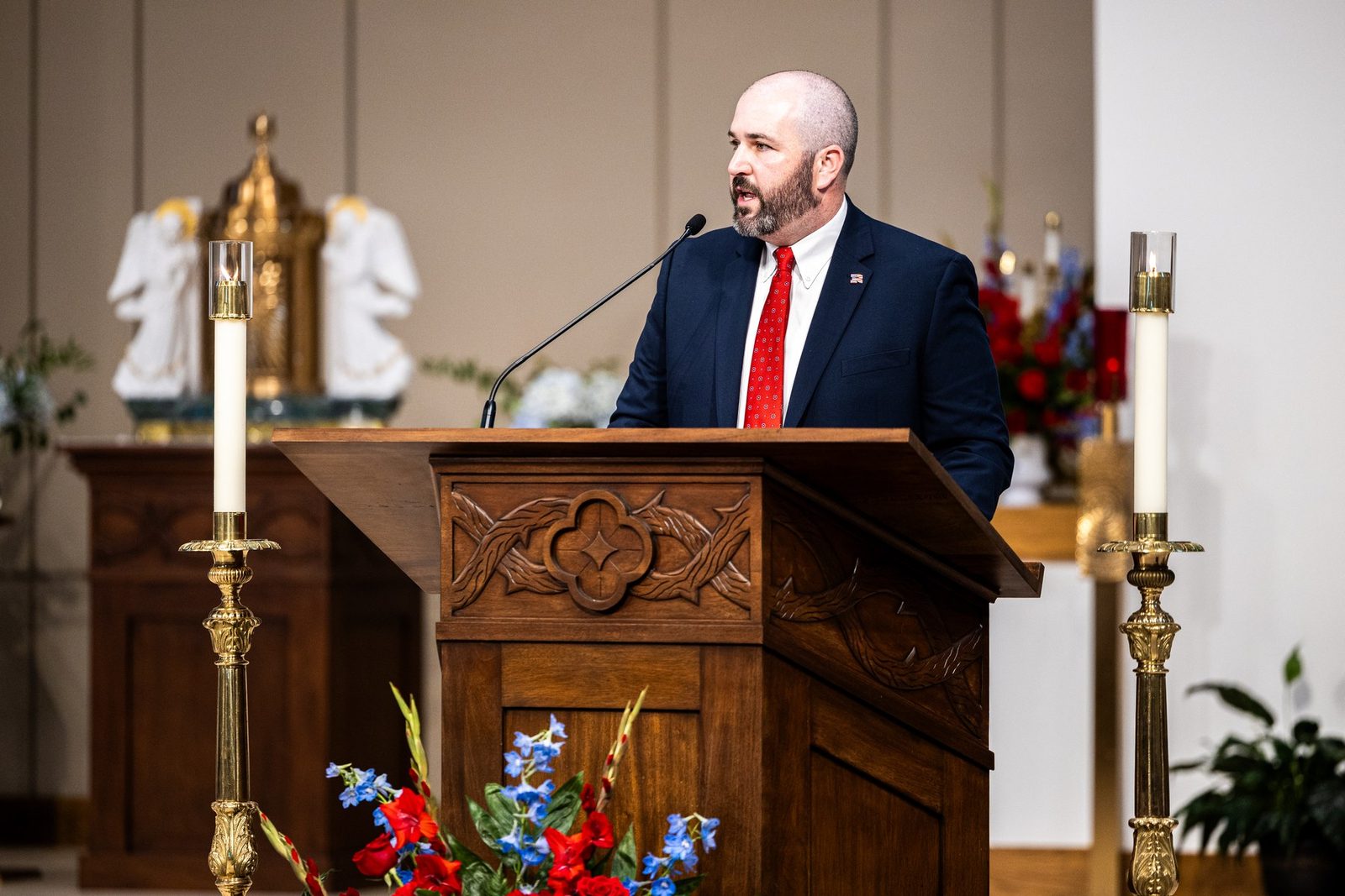 Matthew Caire '03, Head of School, speaking at Mass