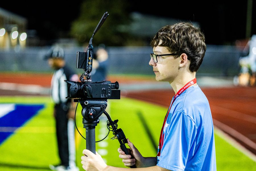 A Rummel student filming a game for the Rummel Streaming Network